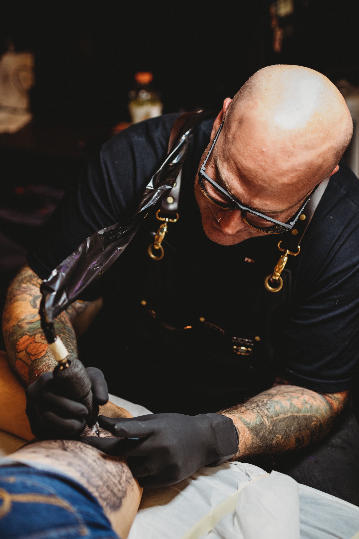 Josh Poindexter tattooing a client at Tornado Tattoo in Oklahoma City