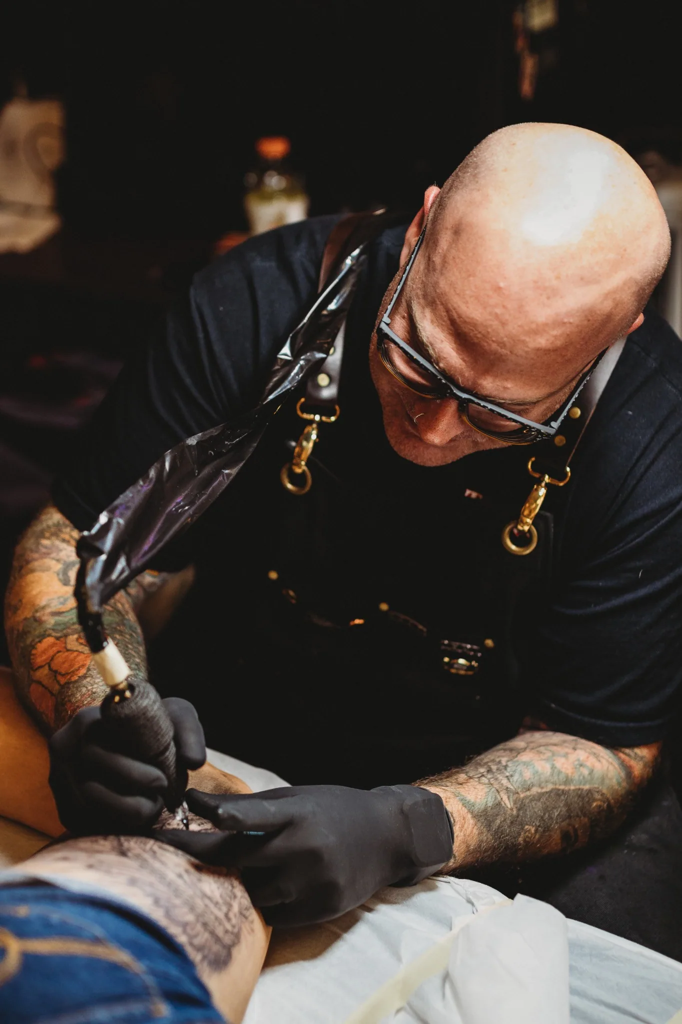 Josh Poindexter tattooing a client at Tornado Tattoo in Oklahoma City